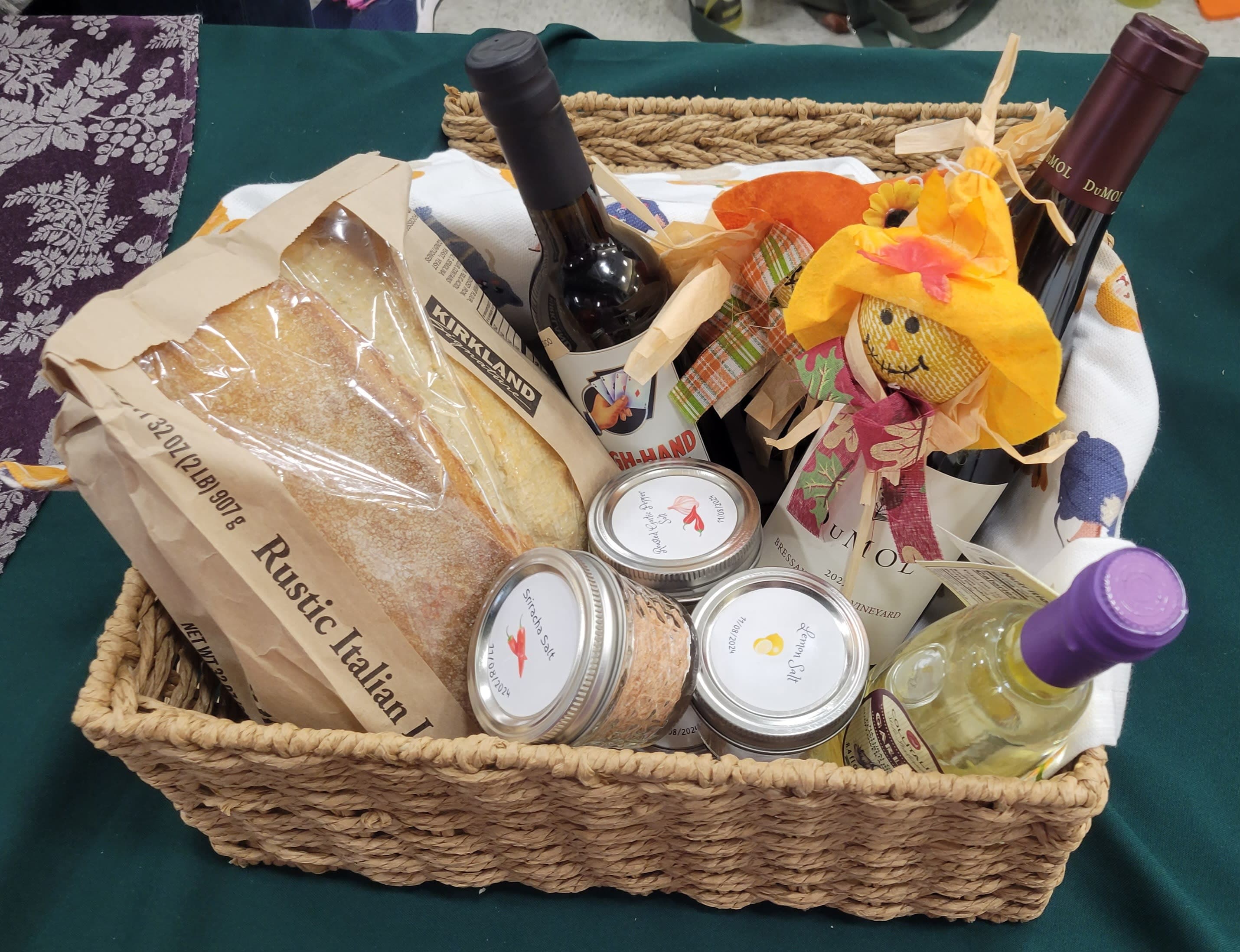 A basket filled with food and condiments on a table