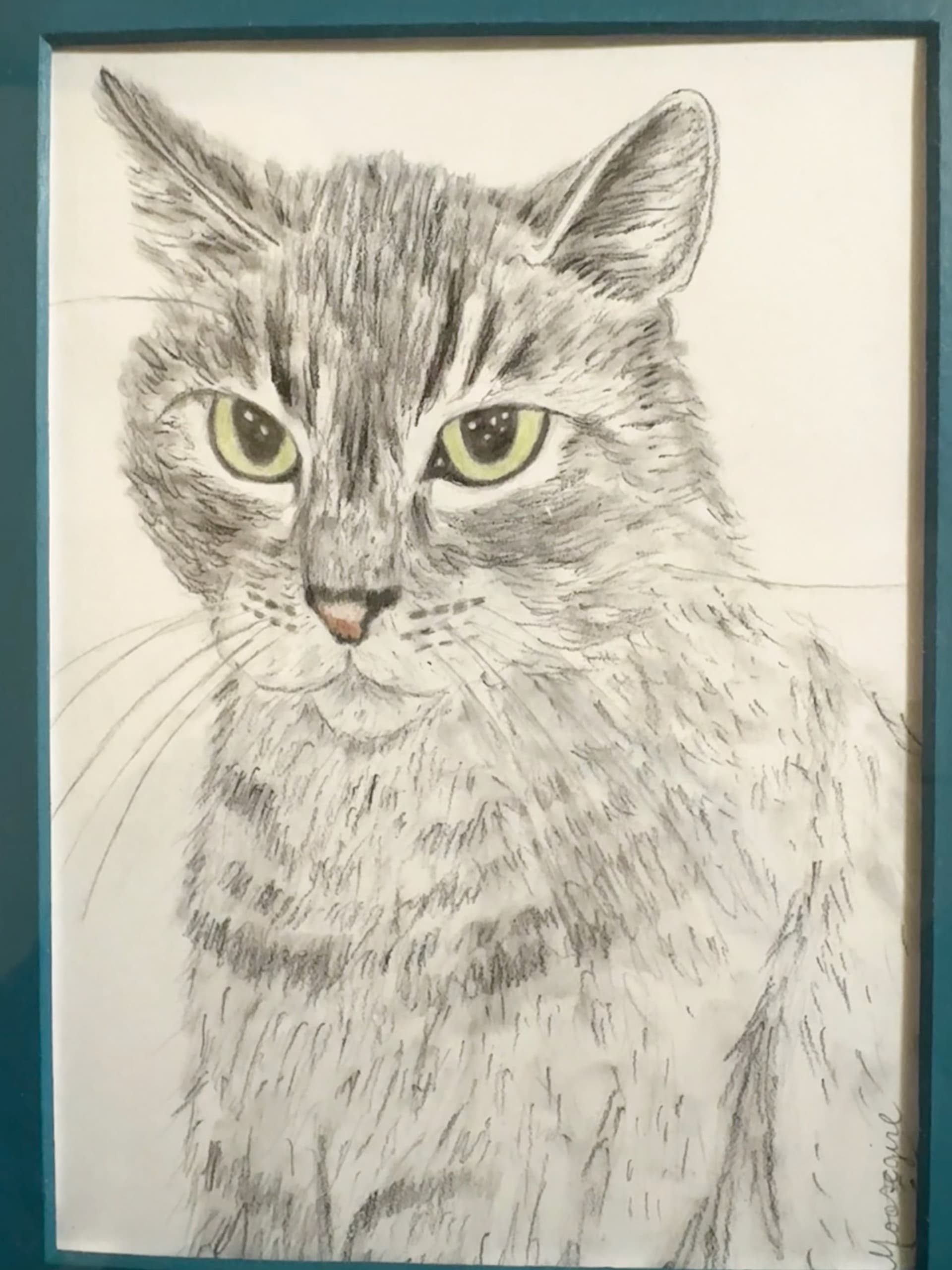 A drawing of a cat with green eyes